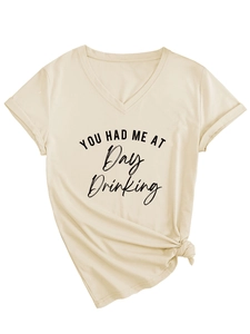 Detail of beige V-neck T-shirt featuring 'Day Drinking' text and trendy front hem knot