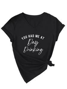 Detail of black V-neck t-shirt with YOU HAD ME AT Day Drinking print and side knot