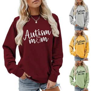 Detail of Autism Mom puzzle print on a crewneck sweatshirt with ribbed cuffs and hem