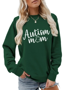 Close-up of dark green Autism Mom sweatshirt with puzzle piece graphic and ribbed cuffs