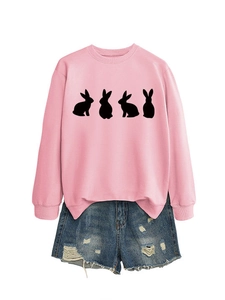 Detail of pink long-sleeve sweatshirt with black rabbit print and frayed denim shorts
