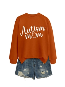 Detail of Autism Mom sweatshirt fabric texture with puzzle piece print and distressed denim