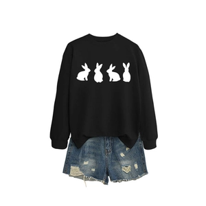 Women's casual oversized black sweatshirt with white rabbit print and denim shorts