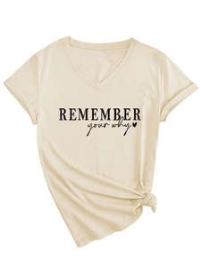 Close-up of beige V-neck T-shirt featuring 'Remember Your Why' print and hem knot detail