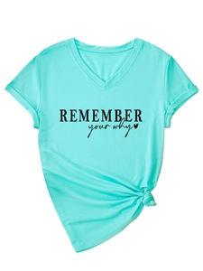Detail of V-neck mint green T-shirt with Remember Your Why slogan and stylish front knot