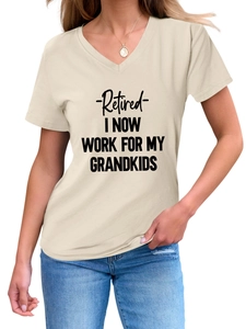 Close-up of beige V-neck cotton T-shirt featuring 'Retired I Now Work For' black slogan