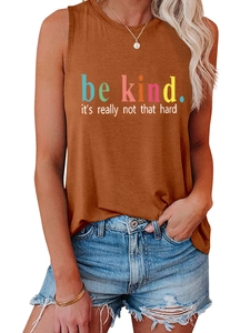 Close-up of burnt orange Be Kind slogan tank top with casual blue denim shorts