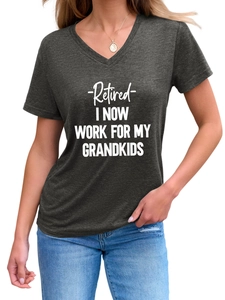 Close-up of Retired I Now Work For My Grandkids text print on dark grey V-neck T-shirt
