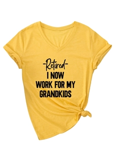 Detail of yellow V-neck T-shirt with 'Retired I Work For My Grandkids' slogan and side knot