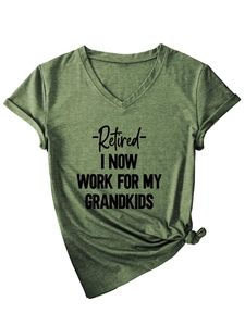 Close-up of V-neck green T-shirt with 'Retired I Now Work For My Grandkids' text and knot detail