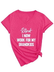 Close-up of rose red V-neck T-shirt featuring a front knot and printed retirement slogan
