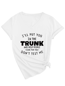 Detail of white V-neck T-shirt featuring a front slogan and stylish knotted hem design