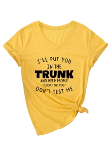 Detail of yellow V-neck T-shirt with humorous slogan and stylish front knot design