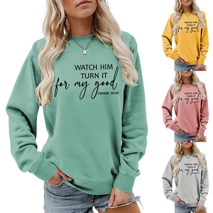 Detail of crewneck sweatshirt with 'WATCH HIM TURN IT' inspirational print and ribbing