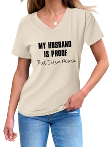 Detail of V-neck beige t-shirt featuring black printed slogan text for women