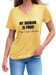 Detail of yellow V-neck t-shirt featuring black My Husband Is Proof printed slogan