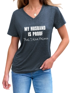 Close-up of V-neck dark grey T-shirt with My Husband Is Proof white graphic text