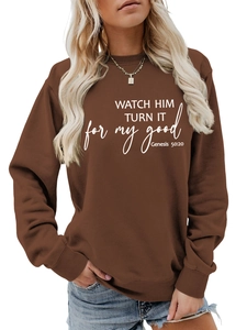 Close-up of ribbed crewneck and high-quality white typography on brown sweatshirt