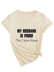 Flat lay of a beige V-neck T-shirt with My Husband Is Proof text and a front knot detail