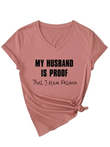 Detail of dusty rose V-neck T-shirt with 'MY HUSBAND IS PROOF' text and front hem knot