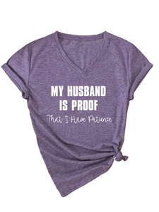 Detail of V-neck T-shirt with My Husband Is Proof slogan and front knot hem detail