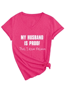 Detail of fuchsia V-neck t-shirt with knotted hem and humorous husband text print