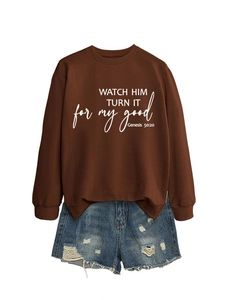 Detail of crewneck sweatshirt with Genesis 50:20 print and distressed denim shorts