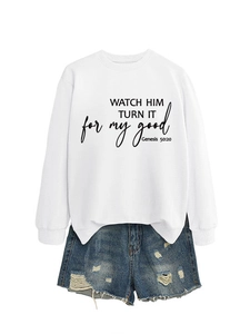 Detail of white crewneck sweatshirt with black script and distressed blue denim shorts