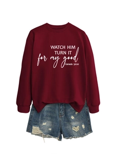 Detail of burgundy crewneck sweatshirt and distressed denim shorts set with graphic print