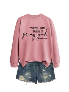Detail of pink crewneck sweatshirt with Bible quote and distressed denim shorts set