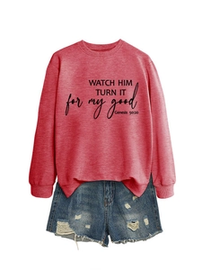 Detail of red crewneck sweatshirt with biblical text print and ripped denim shorts