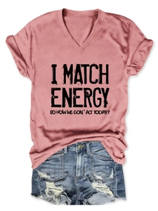 Flat lay of dusty rose V-neck tee with text print and distressed denim shorts