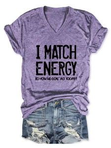 Close-up of purple heather V-neck t-shirt with slogan and distressed denim shorts
