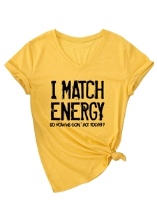 Close-up of yellow V-neck T-shirt featuring a front knot and bold black text slogan