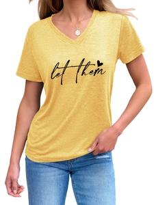 Detailed view of yellow V-neck T-shirt featuring let them printed text and a red heart