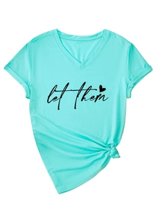 Detail of mint green V-neck T-shirt with 'let them' print and decorative knot hem