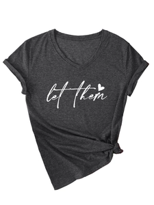 Detail of V-neck T-shirt showing let them text print with rolled sleeves and side knot