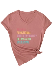 Detail of V-neck short sleeve t-shirt featuring rainbow slogan text and knotted hem