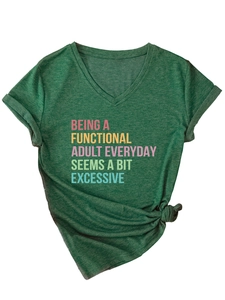 Macro detail of V-neckline and textured dark green fabric with printed typography