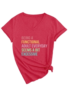 Detail of red V-neck T-shirt showing colorful Being A Functional slogan and knotted hem detail