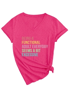 Detail of V-neck fuchsia t-shirt featuring a knot hem and colorful slogan print