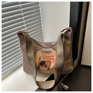 Detailed texture of brown corduroy tote bag with cute cat embroidery and large capacity