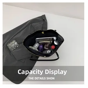 Macro view of leopard print tote bag interior showing large storage capacity and items