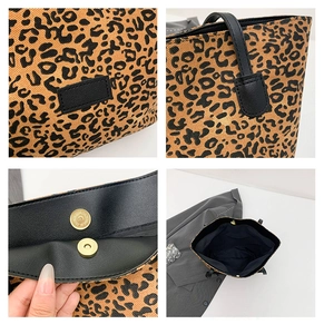 Macro detail of leopard print tote featuring magnetic gold closure and leather handles