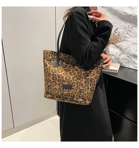 Detail of leopard print tote bag showing large capacity and soft texture on shoulder