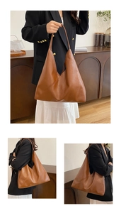 Detail of caramel brown soft leather tote bag showing smooth texture and asymmetrical fold