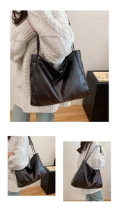 Close-up of the vintage brown faux leather texture and slender straps on the tote bag