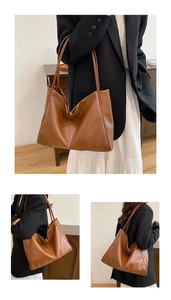 Detail shot of large caramel brown faux leather tote bag showing soft texture and straps