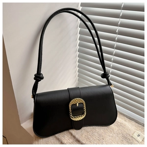 Detail of black underarm bag with large gold buckle and slim double straps