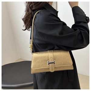 Elegant champagne gold crocodile pattern shoulder bag for women with silver buckle closure